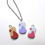 Potion, Super Potion and Hyper Potion clay necklaces.