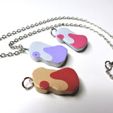 Potion, Super Potion and Hyper Potion clay necklaces.