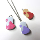 Potion, Super Potion and Hyper Potion clay necklaces.